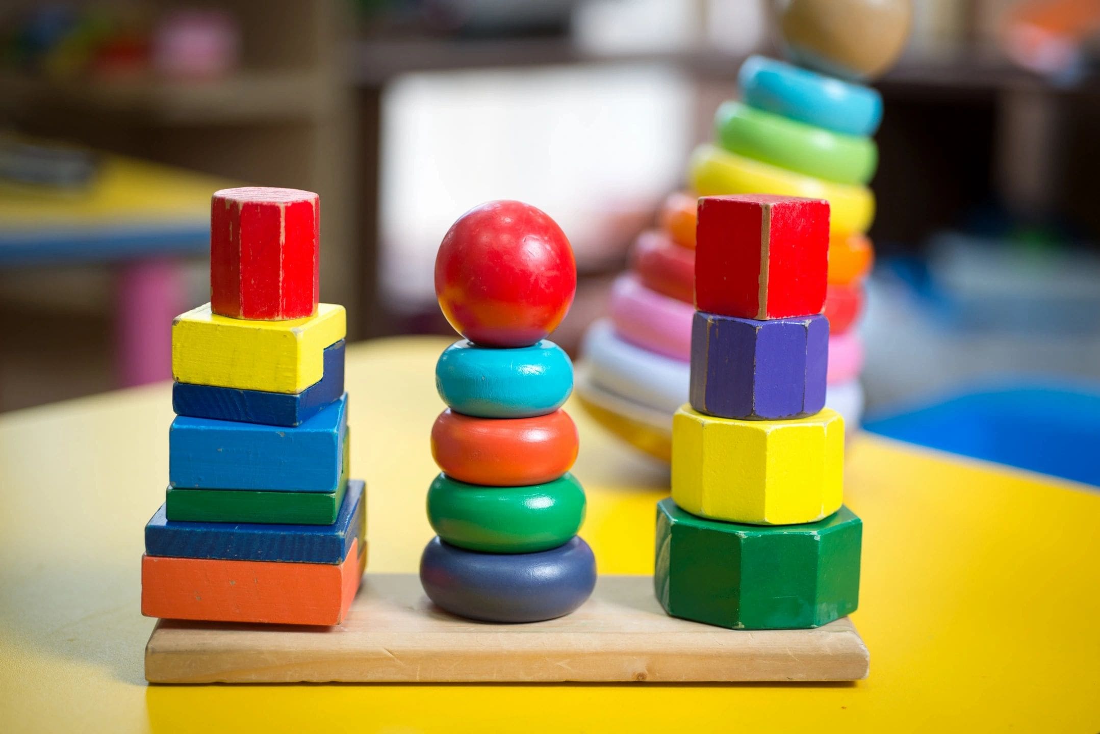 A wooden toy with many different colored blocks.